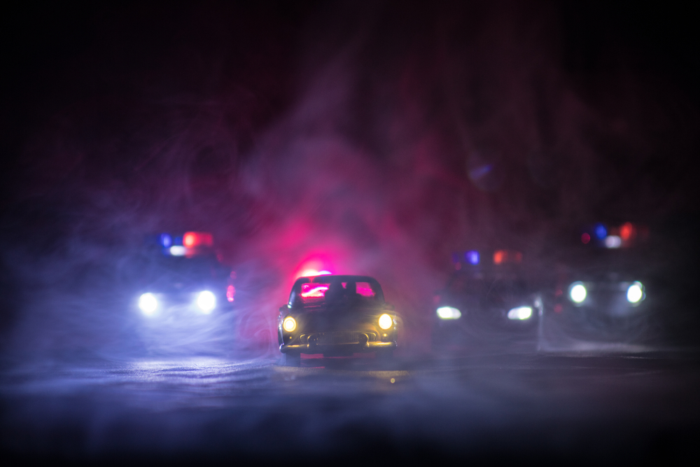 police cars at night with fog