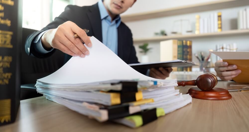 Appellate lawyer reviewing trial records and case files for an aggravated sexual assault conviction appeal in New Jersey.