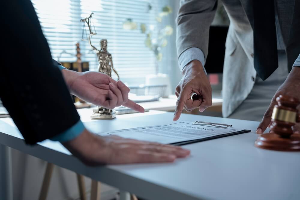 Criminal defense lawyer reviewing controlled dangerous substance (CDS) charges with a client in New Jersey.