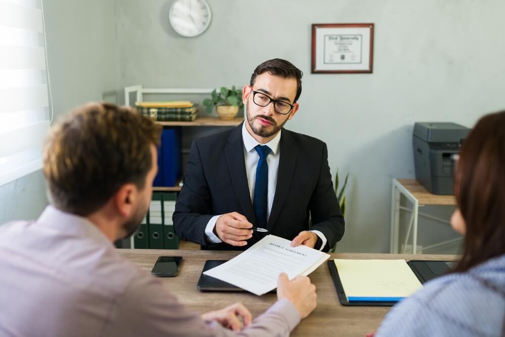 Defense lawyer discussing plea bargaining options for an aggravated sexual assault charge with clients in New Jersey.