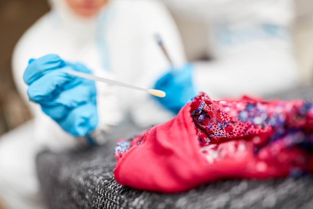 Forensic investigator collecting DNA evidence during a sex crime investigation in NJ.