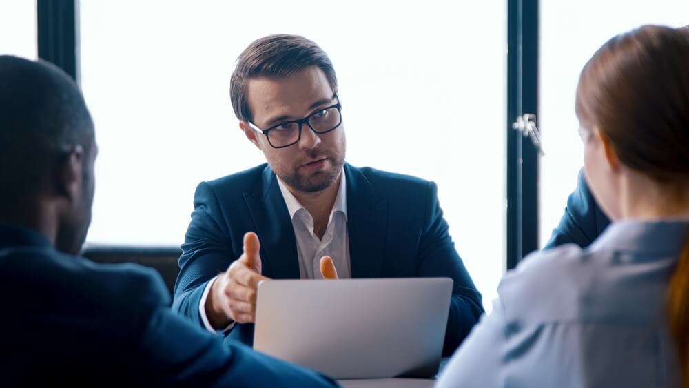 NJ sexual assault defense lawyer consulting clients and reviewing SANE report evidence