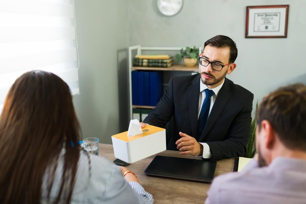 New Jersey child endangerment defense lawyer meeting with parents in office