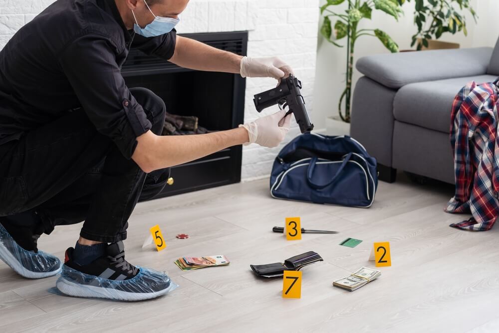 Investigator collecting handgun evidence for an unlawful possession of a weapon case in NJ