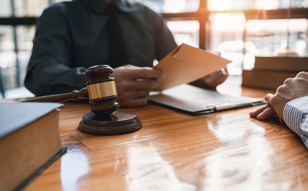 Monmouth County weapons offenses attorney consulting with a client